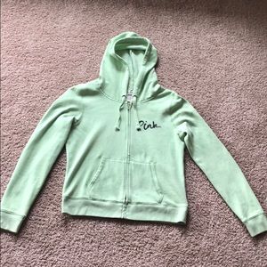 Pink brand green zip up hoodie.